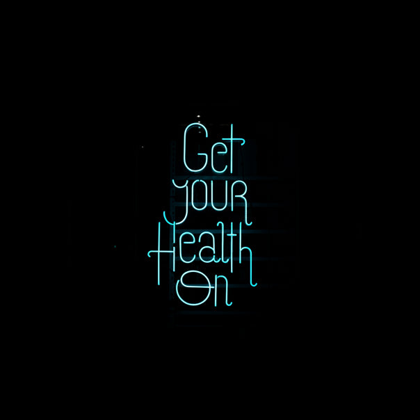 Neon sign with 'Get your Health On' text on a black background